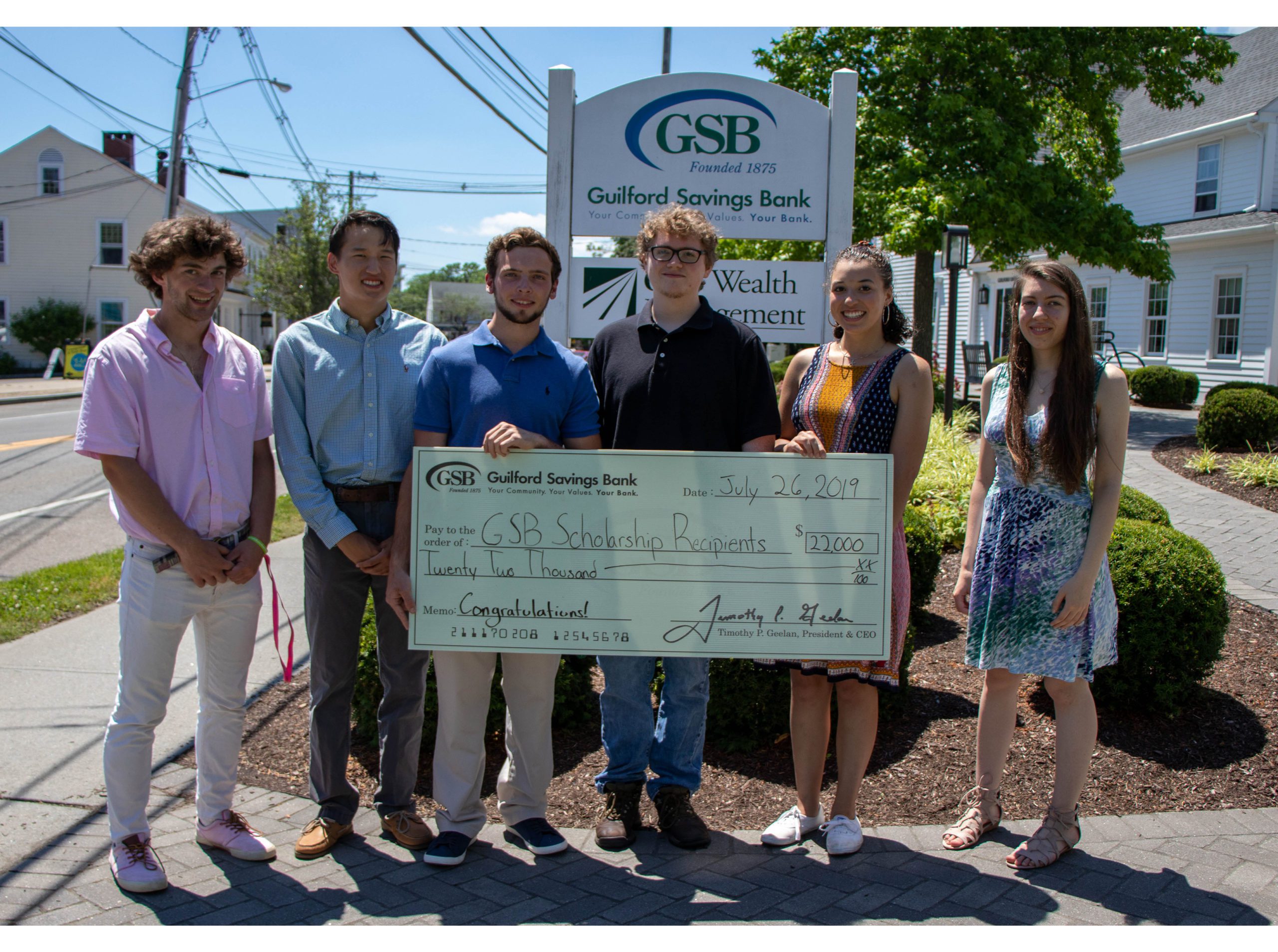 GSB Scholarship Recipients Holding Check
